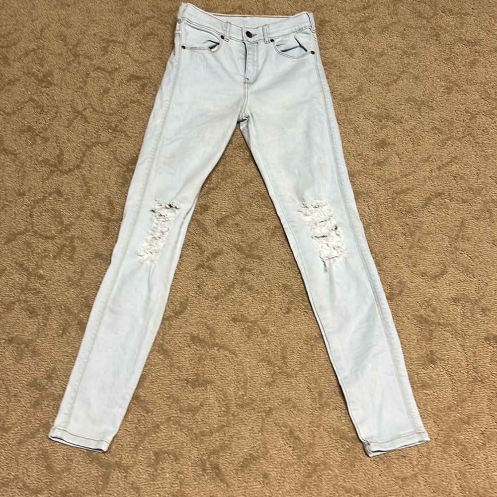 Women’s skinny slightly distressed jeans.